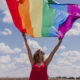 Woman holding LGBTQ flag