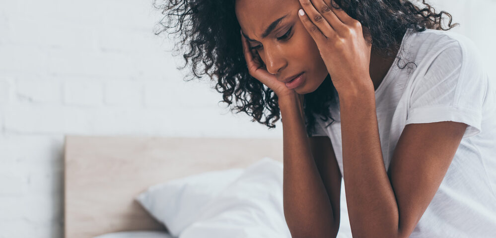 Black woman suffering infertility.