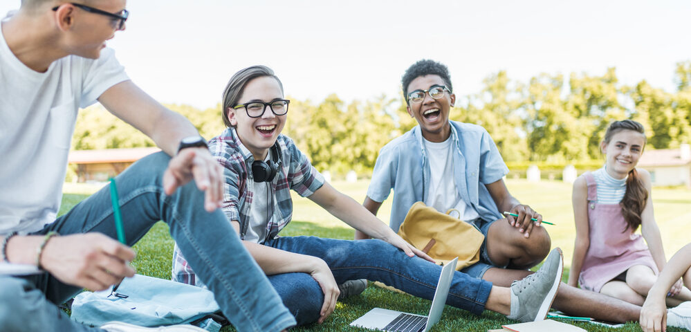 Adolescents enjoying school outside