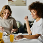 Female couple eating breakfast