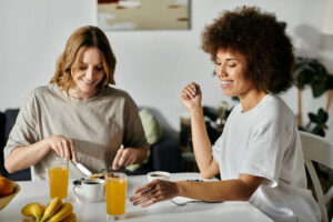 Female couple eating breakfast