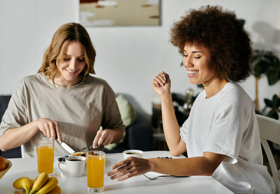 Female couple eating breakfast