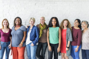 Woman gathered together sharing IVF experiences