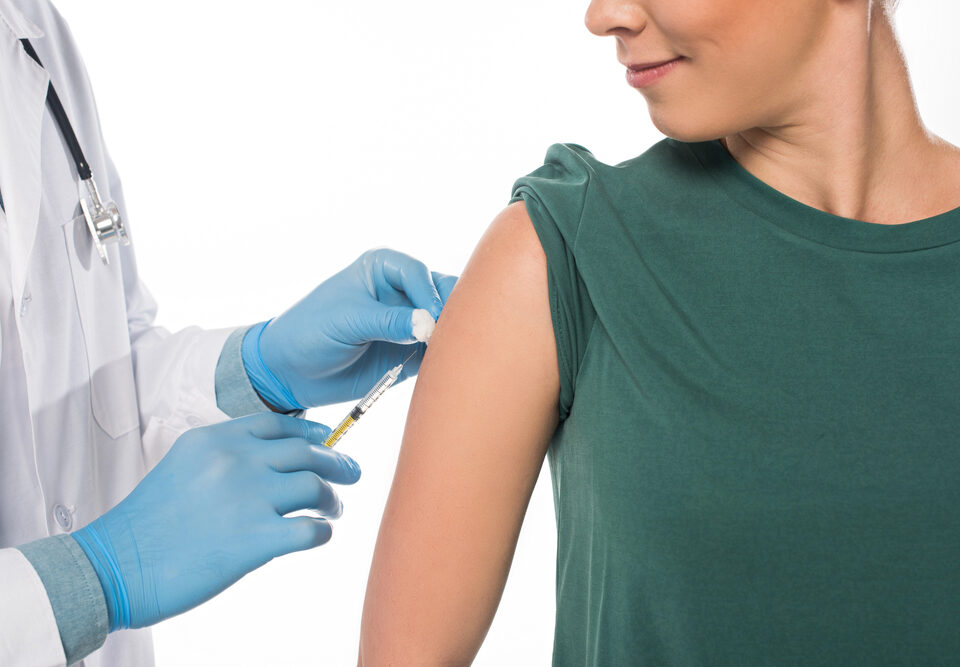 Woman getting COVID-19 vaccine